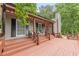 Lovely front porch with rocking chairs, and a nice view of the surrounding greenery at 3329 Walt Stephens Rd, Stockbridge, GA 30281