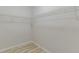Empty walk-in closet features upper shelving on all sides at 3329 Walt Stephens Rd, Stockbridge, GA 30281