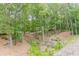 An expansive lot covered in mature trees gives this property a private, secluded feel at 3329 Walt Stephens Rd, Stockbridge, GA 30281