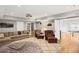 Spacious finished basement with leather furniture, large rug, and recreational game area at 4120 Abingdon, Cumming, GA 30041