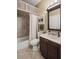Bathroom featuring a shower, toilet, vanity, and a farmhouse-style design at 4120 Abingdon, Cumming, GA 30041