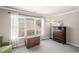 Bedroom featuring a chest of drawers, stylish décor and large windows at 4120 Abingdon, Cumming, GA 30041
