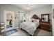 Cozy bedroom with natural light, ceiling fan, and a door to the backyard deck at 4120 Abingdon, Cumming, GA 30041