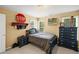 Spacious bedroom with blue wood furnishings, two windows, and unique decor at 4120 Abingdon, Cumming, GA 30041