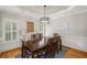 Elegant dining room featuring a tray ceiling and shuttered windows at 4120 Abingdon, Cumming, GA 30041