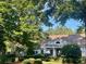 Charming clubhouse exterior with lush landscaping and a playground area at 4120 Abingdon, Cumming, GA 30041