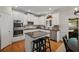 Charming kitchen featuring granite countertops, stainless steel appliances and an island with barstool seating at 4120 Abingdon, Cumming, GA 30041