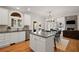 Open concept kitchen with granite countertops, stainless appliances, a central island and hardwood floors at 4120 Abingdon, Cumming, GA 30041