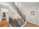 Elegant staircase with wood and iron railings and hardwood floors at 4120 Abingdon, Cumming, GA 30041