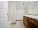 This bathroom has a tub, toilet, and vanity with mirror at 4214 Fiddlers Bnd, Loganville, GA 30052