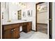 Bathroom boasts a double sink vanity with wood cabinets and modern fixtures at 4214 Fiddlers Bnd, Loganville, GA 30052