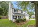 Charming two-story home with blue shutters, well-maintained lawn and a chimney on the left side at 4214 Fiddlers Bnd, Loganville, GA 30052