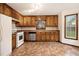 Functional kitchen featuring wooden cabinets at 4214 Fiddlers Bnd, Loganville, GA 30052
