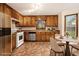 Traditional kitchen with stainless steel appliances, light countertops and a dining area at 4214 Fiddlers Bnd, Loganville, GA 30052