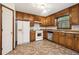 Efficient kitchen with wooden cabinets and stainless steel dishwasher at 4214 Fiddlers Bnd, Loganville, GA 30052