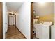 Convenient laundry room access from hallway with washer and dryer at 4214 Fiddlers Bnd, Loganville, GA 30052