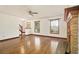 Open living room with hardwood floors and a fireplace at 4214 Fiddlers Bnd, Loganville, GA 30052