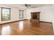 Spacious living room featuring hardwood floors and a brick fireplace at 4214 Fiddlers Bnd, Loganville, GA 30052