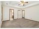 Spacious main bedroom with plush carpet, two entry doors, and tray ceiling at 4214 Fiddlers Bnd, Loganville, GA 30052