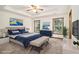 Calm main bedroom features a trey ceiling, two bright windows and a sitting bench at 4214 Fiddlers Bnd, Loganville, GA 30052
