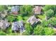 Overhead view of a residence surrounded by lush trees, highlighting its private lot and neighborhood charm at 4770 Spring Park Cir, Suwanee, GA 30024