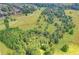 Picture of a beautiful community and park with a landscape of green grass and wooded areas at 4770 Spring Park Cir, Suwanee, GA 30024