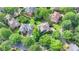 Aerial image of a home nestled among mature trees, showcasing the neighborhood's peaceful setting at 4770 Spring Park Cir, Suwanee, GA 30024