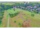 Expansive aerial view of a beautiful community with green landscapes at 4770 Spring Park Cir, Suwanee, GA 30024