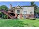 Spacious backyard with playset, trampoline, shed, and deck offers ample space for outdoor activities at 4770 Spring Park Cir, Suwanee, GA 30024