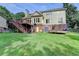Backyard featuring two-level deck, shed, trampoline, and playset for endless outdoor enjoyment at 4770 Spring Park Cir, Suwanee, GA 30024