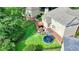 Beautiful backyard with a deck, playset, trampoline, and well-maintained lawn at 4770 Spring Park Cir, Suwanee, GA 30024