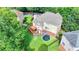 Beautiful backyard with a deck, playset, trampoline, and well-maintained lawn at 4770 Spring Park Cir, Suwanee, GA 30024