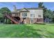 Large backyard featuring a two-level deck, playset, shed and trampoline at 4770 Spring Park Cir, Suwanee, GA 30024