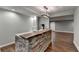 Finished basement features a stylish bar with stone accents and a wooden countertop for entertaining at 4770 Spring Park Cir, Suwanee, GA 30024