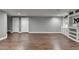 Spacious finished basement with hardwood floors and ample room for recreation or storage at 4770 Spring Park Cir, Suwanee, GA 30024
