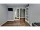 Finished basement featuring hardwood floors, modern lighting, and glass paneled doors at 4770 Spring Park Cir, Suwanee, GA 30024