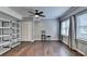 Finished basement space featuring hardwood floors, shelving, and natural light from the window at 4770 Spring Park Cir, Suwanee, GA 30024