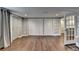 Large basement area with hardwood floors, multiple closets, and access to additional storage at 4770 Spring Park Cir, Suwanee, GA 30024