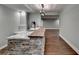 Finished basement features a stylish bar with stone accents and a wooden countertop for entertaining at 4770 Spring Park Cir, Suwanee, GA 30024