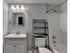 Cozy bathroom featuring a vanity, toilet, mirror, and a shower/tub combo for convenience at 4770 Spring Park Cir, Suwanee, GA 30024