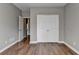 Bedroom featuring a ceiling fan, closet, and hardwood floors at 4770 Spring Park Cir, Suwanee, GA 30024