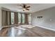 Bedroom with hardwood floors, natural light, and a ceiling fan at 4770 Spring Park Cir, Suwanee, GA 30024