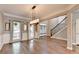 Open-concept living area boasts hardwood floors and lots of light at 4770 Spring Park Cir, Suwanee, GA 30024