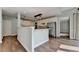 Kitchen showing connection to dining area with stainless appliances and bar seating at 4770 Spring Park Cir, Suwanee, GA 30024