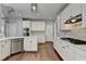 Contemporary kitchen with white cabinets, stainless appliances and tile backsplash at 4770 Spring Park Cir, Suwanee, GA 30024