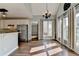 Kitchen showing connection to dining area with lots of natural light and stainless appliances at 4770 Spring Park Cir, Suwanee, GA 30024