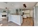 Open kitchen with white cabinets, stainless appliances, and breakfast bar at 4770 Spring Park Cir, Suwanee, GA 30024