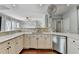 Updated kitchen featuring stone countertops, stainless steel appliances and bar seating at 4770 Spring Park Cir, Suwanee, GA 30024