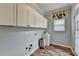 Functional laundry room with ample cabinet space and a sink at 4770 Spring Park Cir, Suwanee, GA 30024