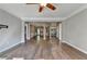 Bright living room boasting hardwood floors, ceiling fan and open floor plan at 4770 Spring Park Cir, Suwanee, GA 30024